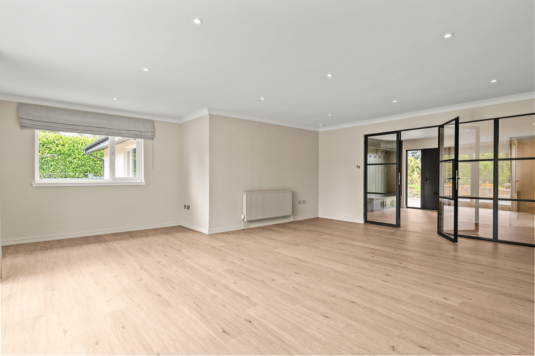 Second view of the living space at Auchterarder looking back towards the glazed internal doors