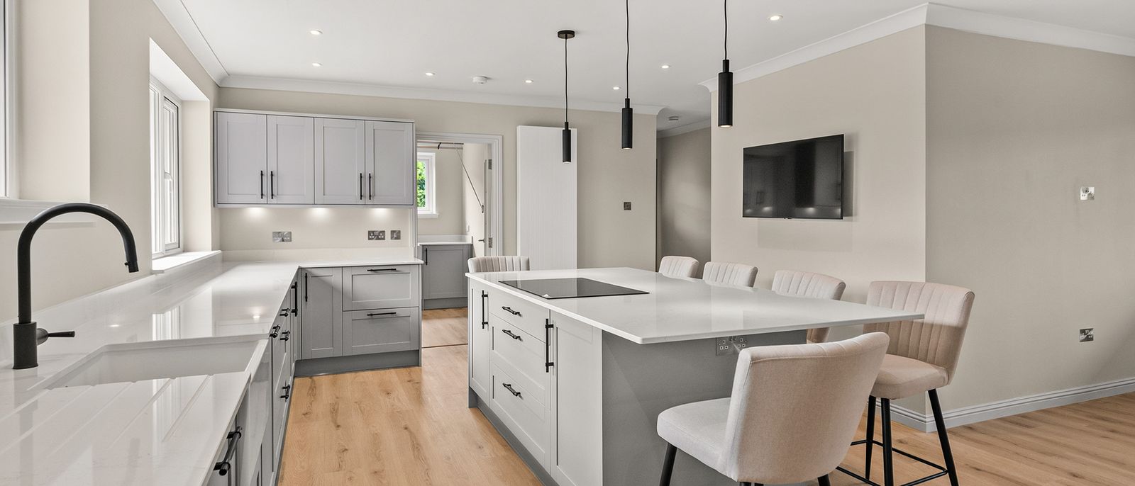 Open plan kitchen in a house in Auchterarder with shaker units and an island, finished by Brock Contracts