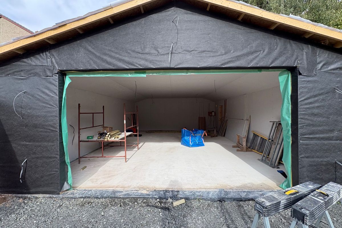 A new garage under construction in Perthshire, wrapped in breather membrane with the roof formed