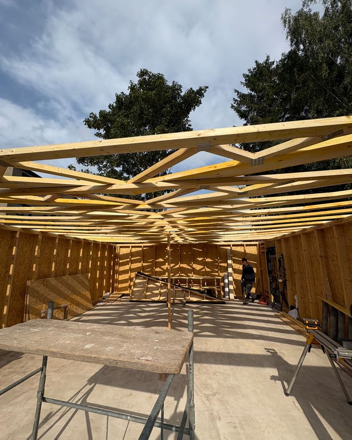 Timber roof trusses erected over the frame of a new garage in Perthshire