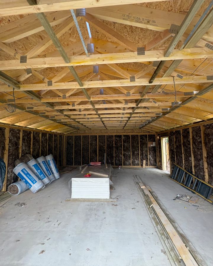 A garage under construction in Perthshire with insulation fitted between the timbers and plasterboard ready